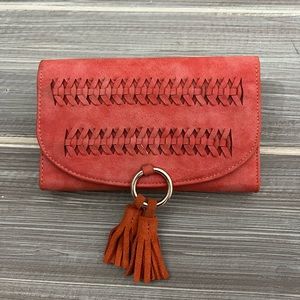 Brand new Anthropologie clutch with tassel design
